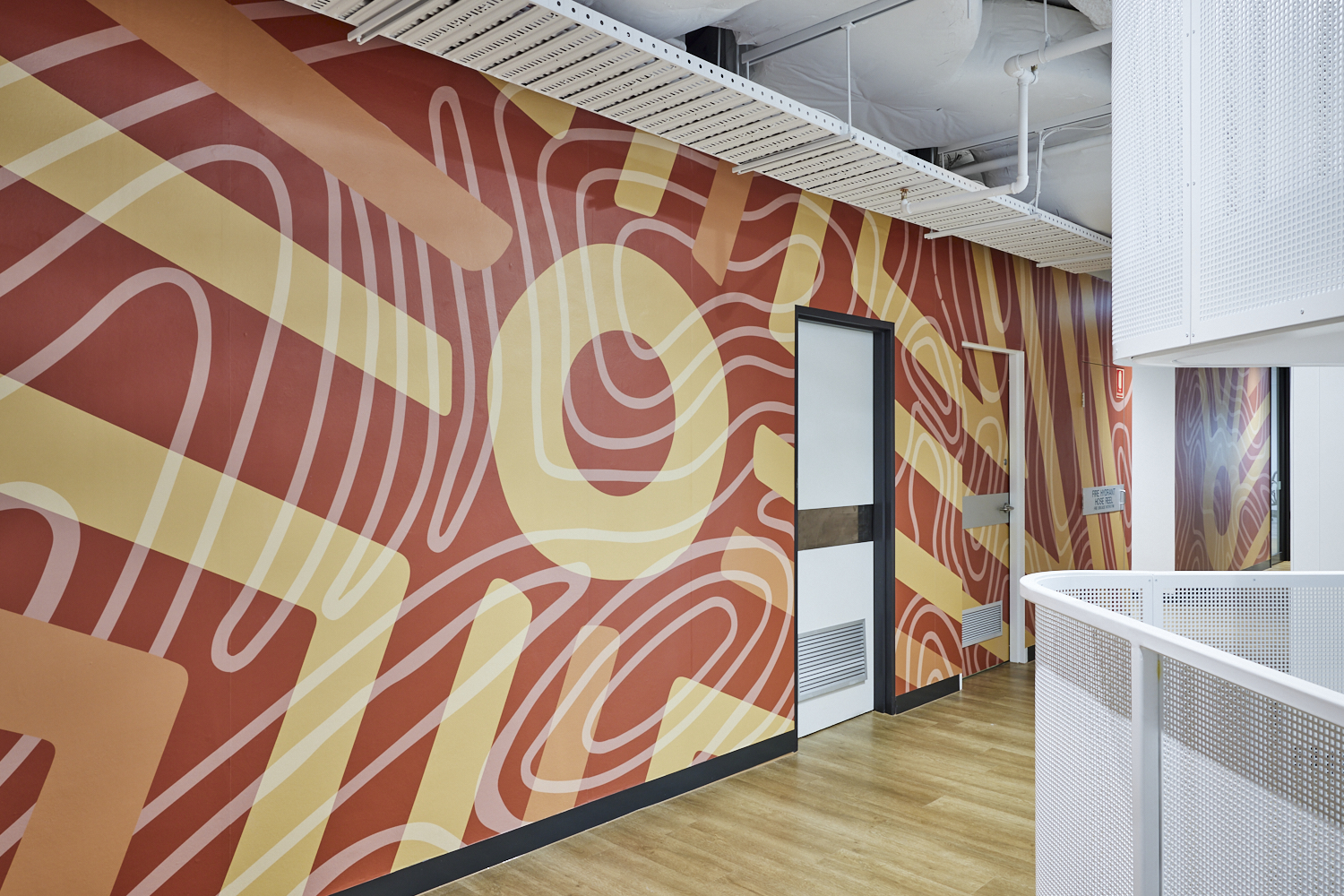 Dennis Golding mural in an office
