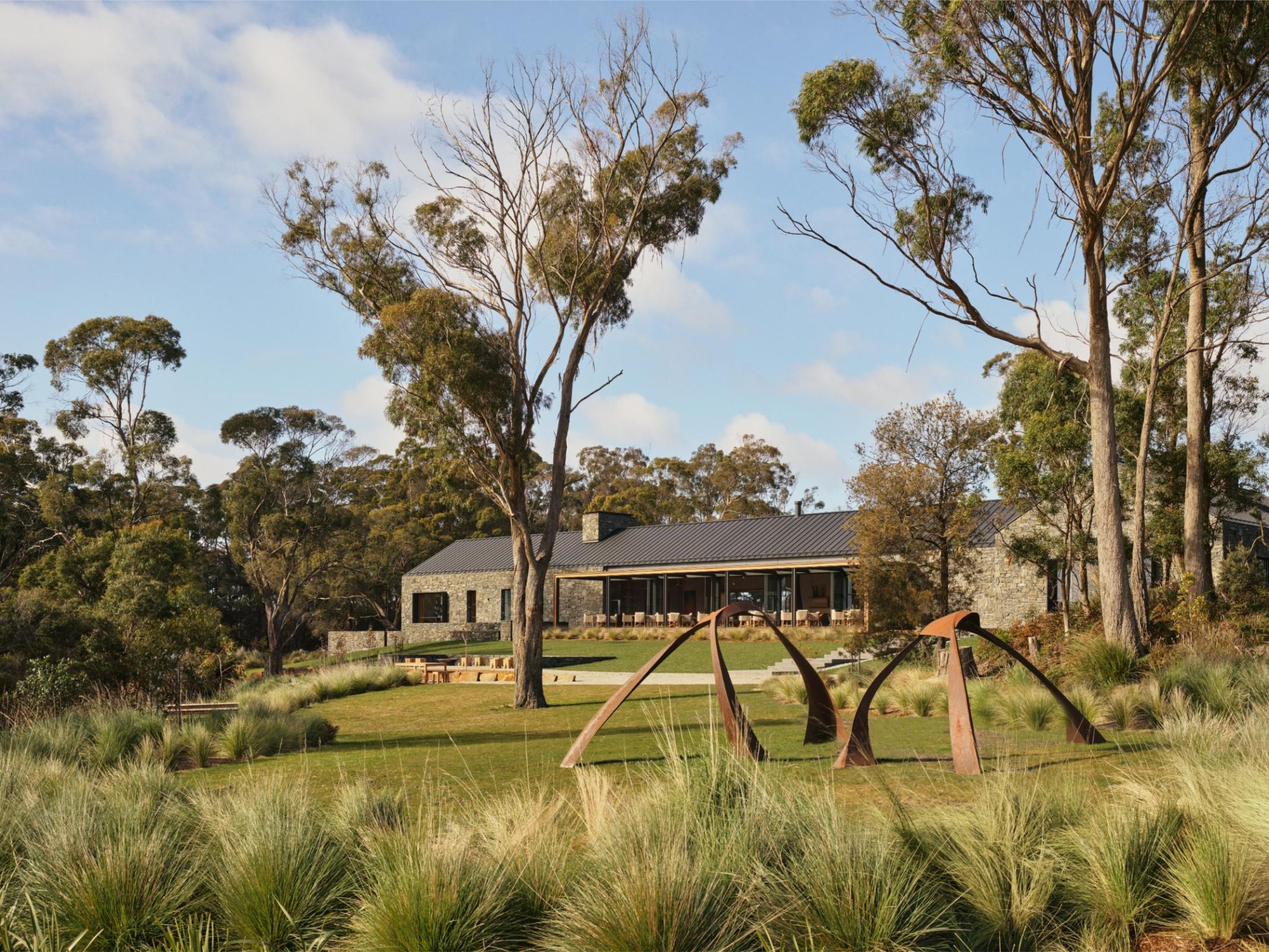 outdoor sculpture in Australian vineyard with house