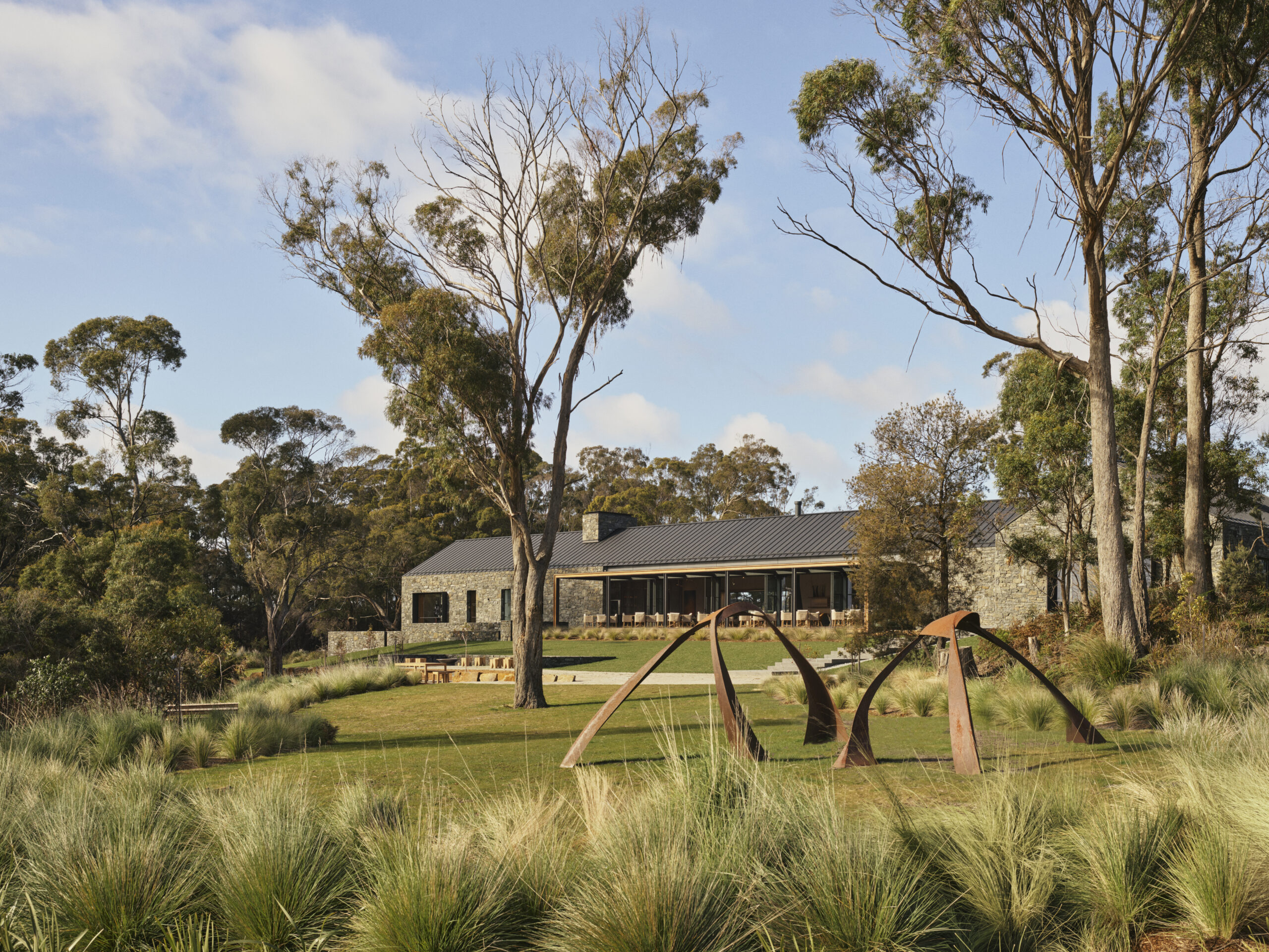outdoor sculpture in Australian vineyard with house